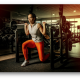 A girl in a commercial gym doing weight lifting - Verdure Wellness